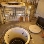 Iran technicians work on the Arak heavy water reactors secondary circuit