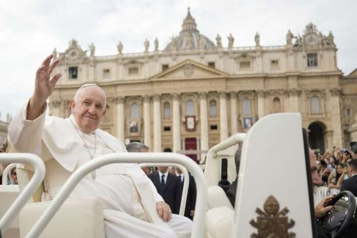 Pope Francis delivers his blessing as he leaves St Peters square