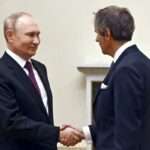 Russian President Vladimir Putin and IAEA Director General Rafael Mariano Grossi