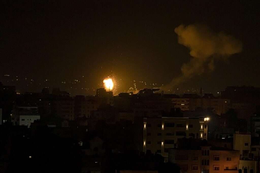 Fire and smoke rises following an Israeli airstrike in central Gaza Strip