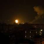 Fire and smoke rises following an Israeli airstrike in central Gaza Strip