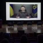 President of Ukraine Volodymyr Zelensky speaks via a video link