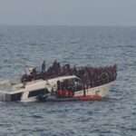 rescuing migrants from a boat sinking in the Mediterranean Sea