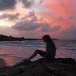 girl sitting at beach