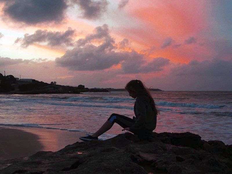 girl sitting at beach