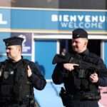 French CRS riot police officers secure the area outside the Parc des Princes stadium