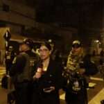 Peru A reporter speaks as police guard outside President Dina Boluartes house during a raid