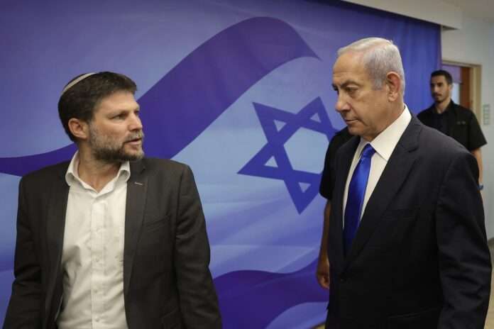 Prime Minister Benjamin Netanyahu right talks with Finance Minister Bezalel Smotrich