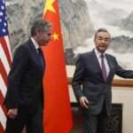 US Secretary of State Antony Blinken L follows Chinas Foreign Minister Wang Yi