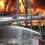Firefighters work to extinguish a fire