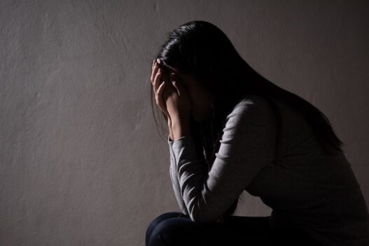 sad woman close her face cry sad woman sitting alone dark room 53476 5052